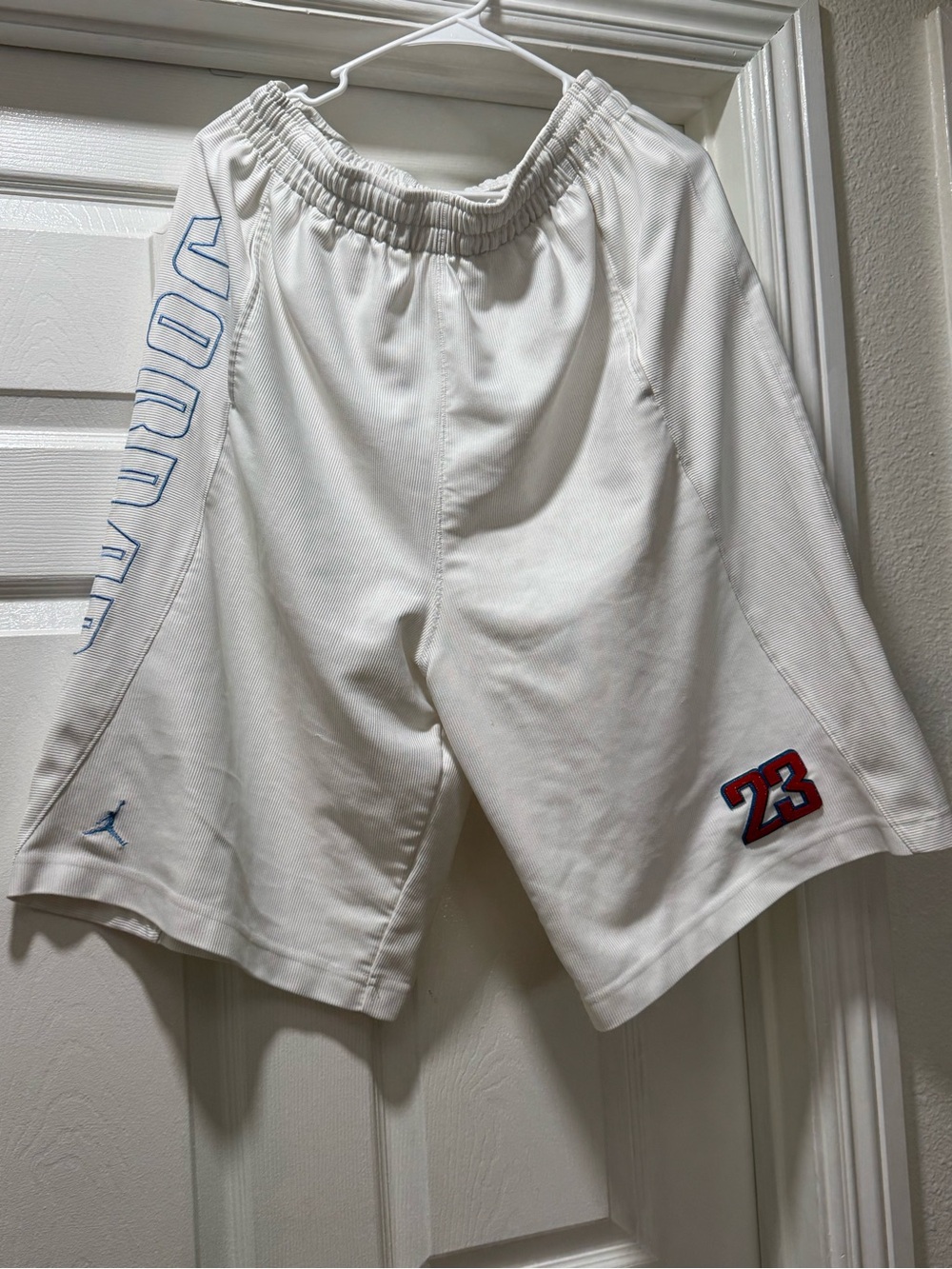 Jordan Men’s White Athletic Basketball Shorts with Blue and Red Accents